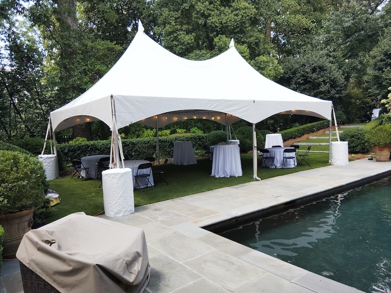 Tent rental cost Atlanta — 20x30 tent with tables, chairs and lighting in a backyard